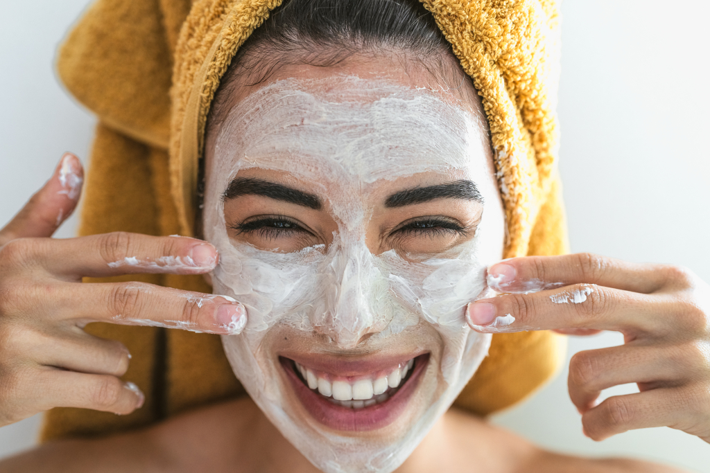 Happy girl smiling with face mask from my purity spa