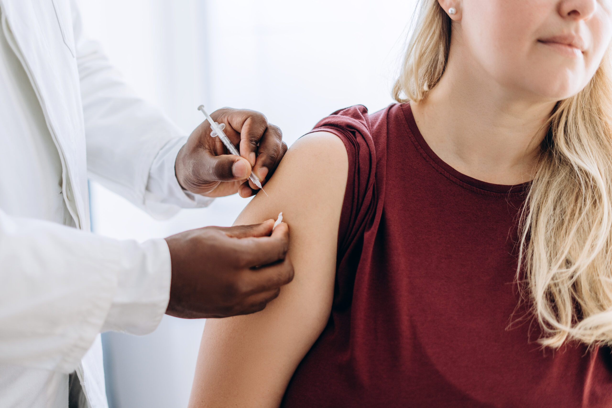 Doctor giving Vitamin B12 injection to woman